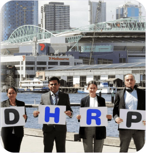 DHRP team holding brand letters